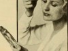 1916-woman-applies-eye-makeup